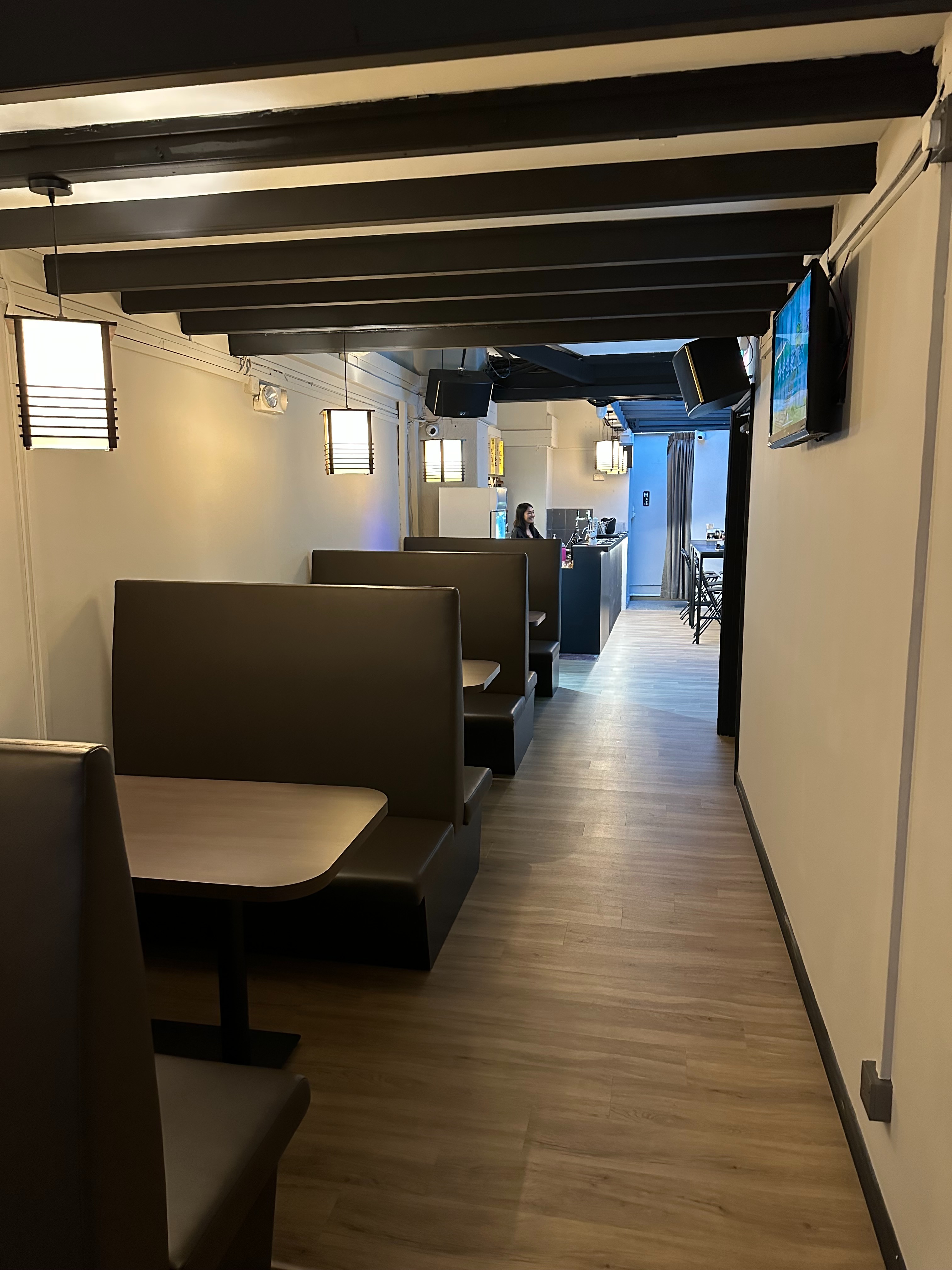Izakaya Play second floor booth seating with ambient lighting
